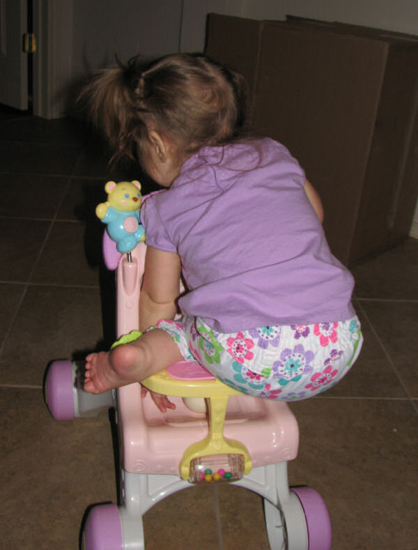 Climbing into Doll Stroller, 10/25/10