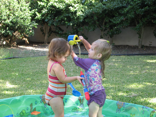 Jessica Attempting to Pour Water on Millie's Head, 7/14/11